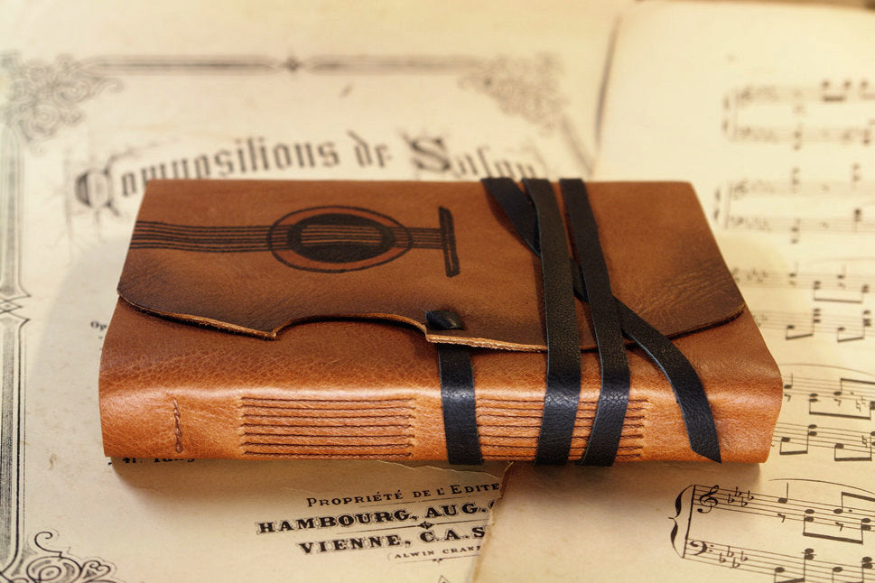 Music - leather journal with vintage style paper in orange brown