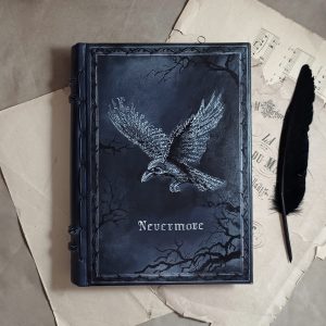 Dark leather journal featuring a raven on the covermade from calligraphy lyrics, reminding of Edgar Allan Poe's poetry.